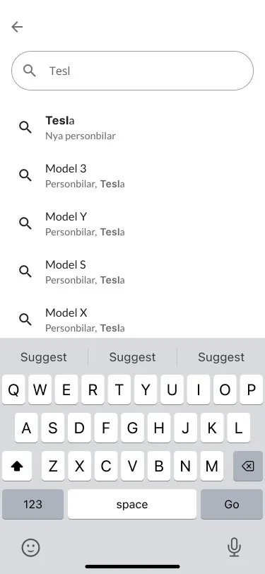 Search on mobile with the letters Tesl typed and suggestions for Tesla and its models above the keyboard